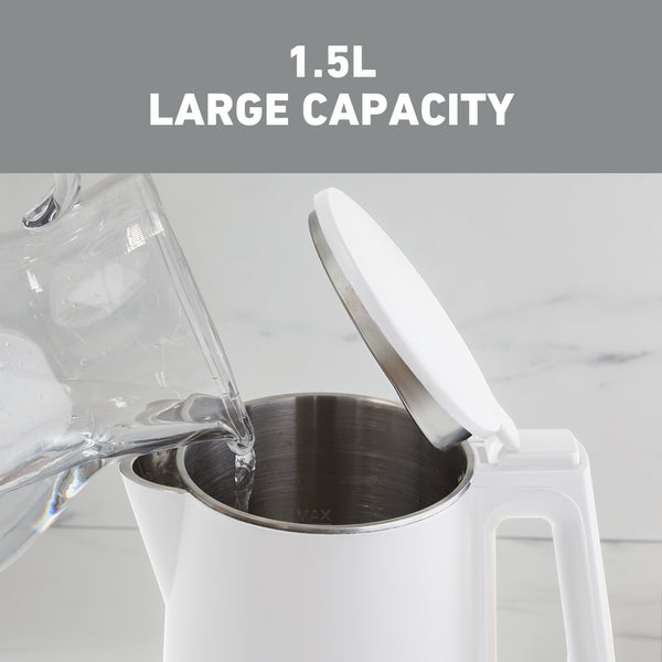 White electric kettle with open lid and stainless interior with MAX fill line