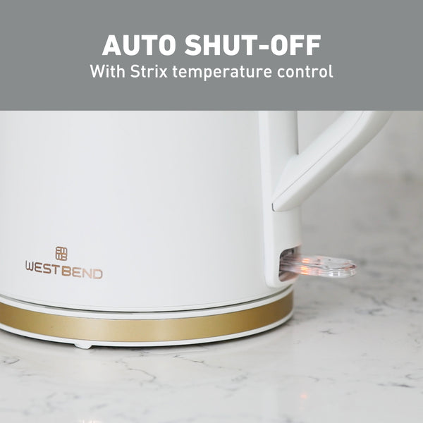 White electric kettle with illuminated base area and gold trim
