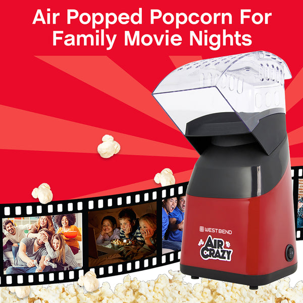 Red air popcorn machine with clear lid and popped popcorn in bowl