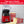 Red air popcorn machine with popcorn box and glass bowl of popped corn
