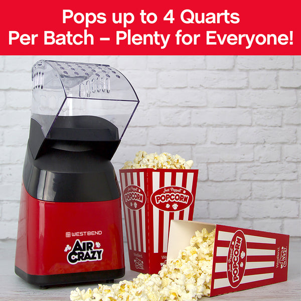 Red air popcorn machine with popcorn box and glass bowl of popped corn