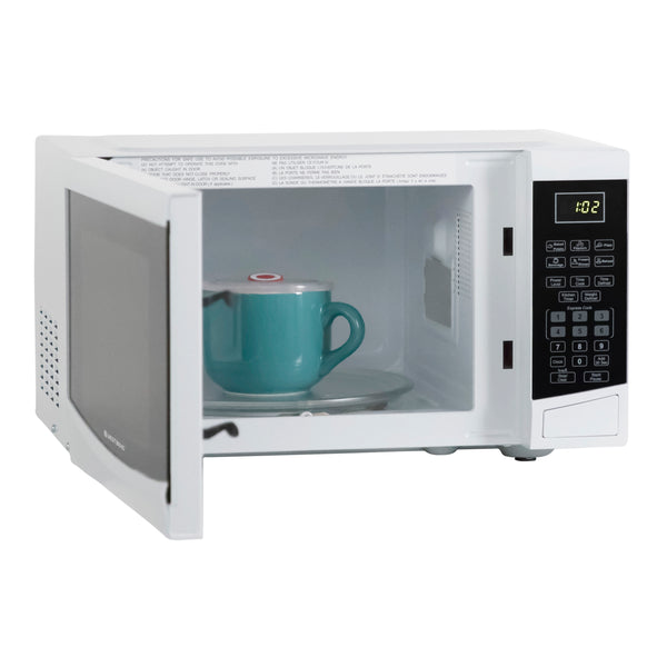 White microwave oven door open with teal mug on glass turntable