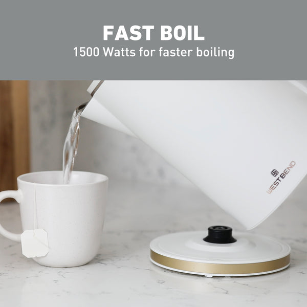White electric kettle pouring hot water into a cup; lid open