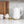 White electric kettle on countertop with gold base ring and side handle