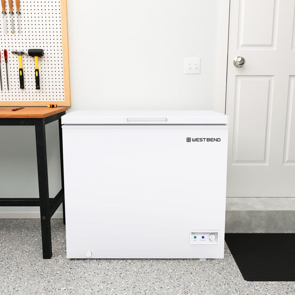 White chest freezer with closed lid and control panel, WEST BEND logo