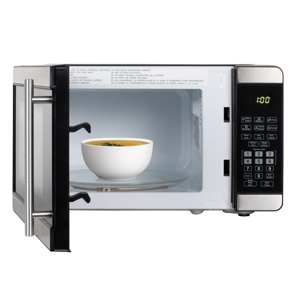 0.7 cu. ft. microwave oven door open with cup on glass tray