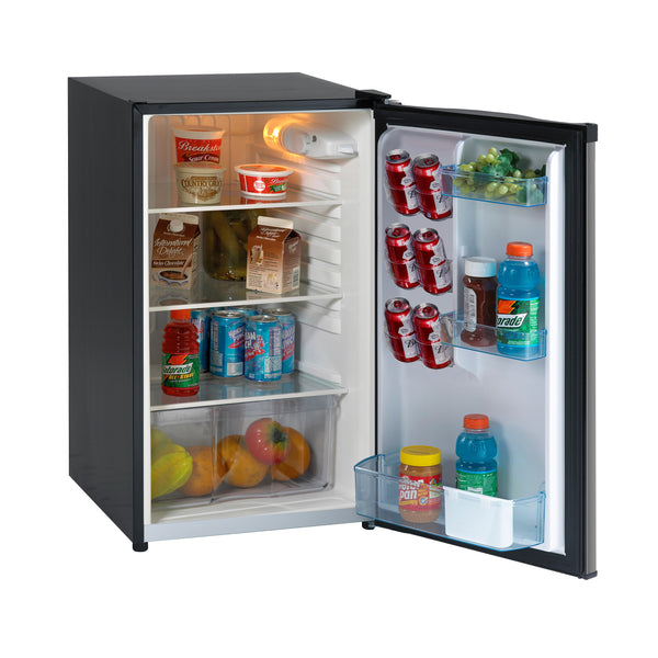 Compact refrigerator open with interior light and shelves of food and drinks