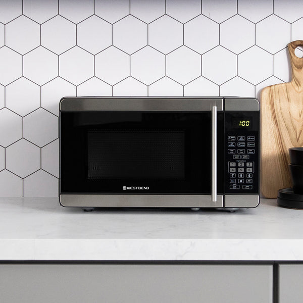 0.7 cu. ft. microwave oven with black window and stainless door handle