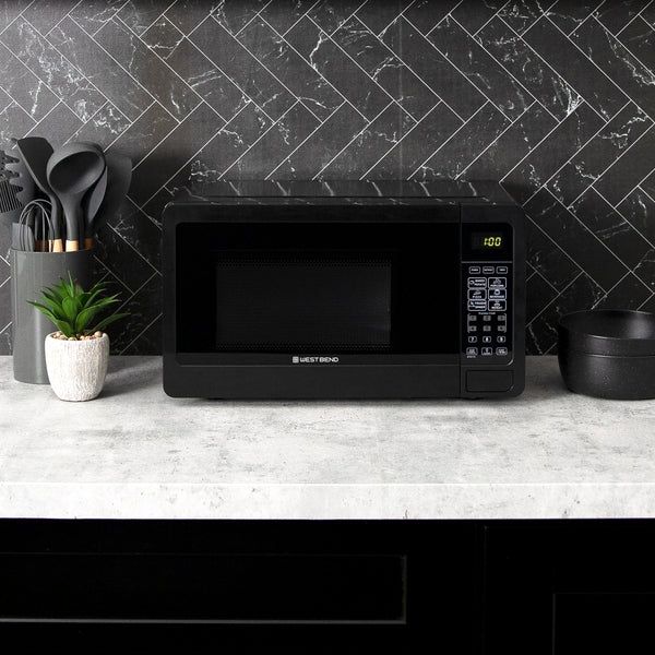 0.7 cu. ft. microwave oven on kitchen counter with black viewing window