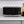 Black microwave oven front view on counter with keypad and handle