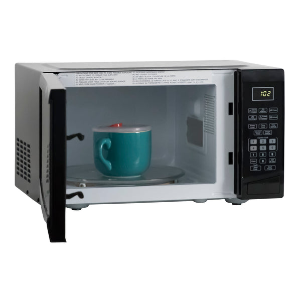 White microwave oven door open showing teal mug on turntable