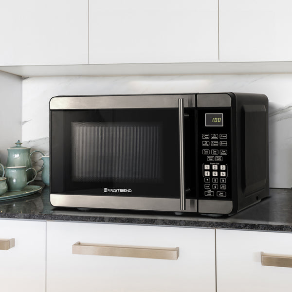 0.7 cu. ft. microwave oven built into kitchen cabinetry with right-side keypad