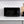 0.7 cu. ft. microwave oven with black window and lit display on right