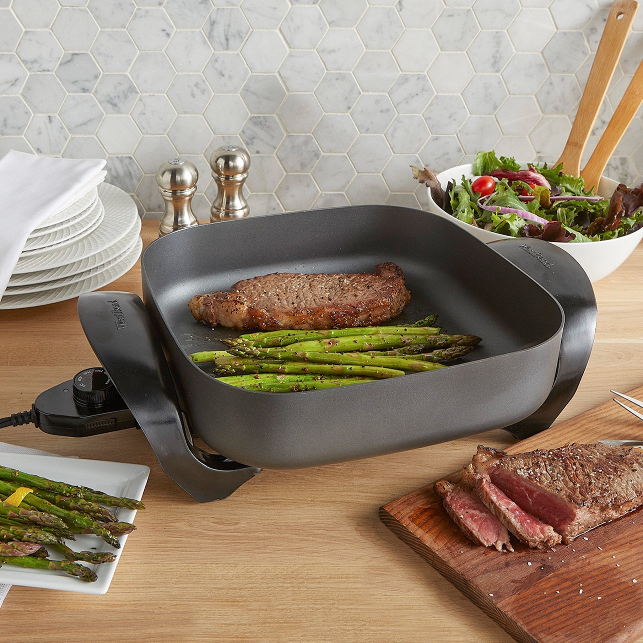 https://westbend.com/cdn/shop/products/west-bend-12-inch-electric-skillet-with-non-stick-coating-skwb12gy13-west-bend-500867.jpg?v=1703745327